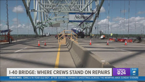 Construction crews install eight steel plates on I-40 bridge