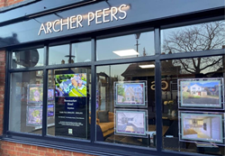 Archer Peers estate agents utilize ECS5 to showcase high quality video content in their eye-catching window display