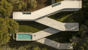 Fran Silvestre Arquitectos references pathways for winding Sabater House in Spain