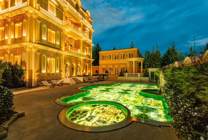 Glass slabs and lighting by Sicis form jewel-like pool